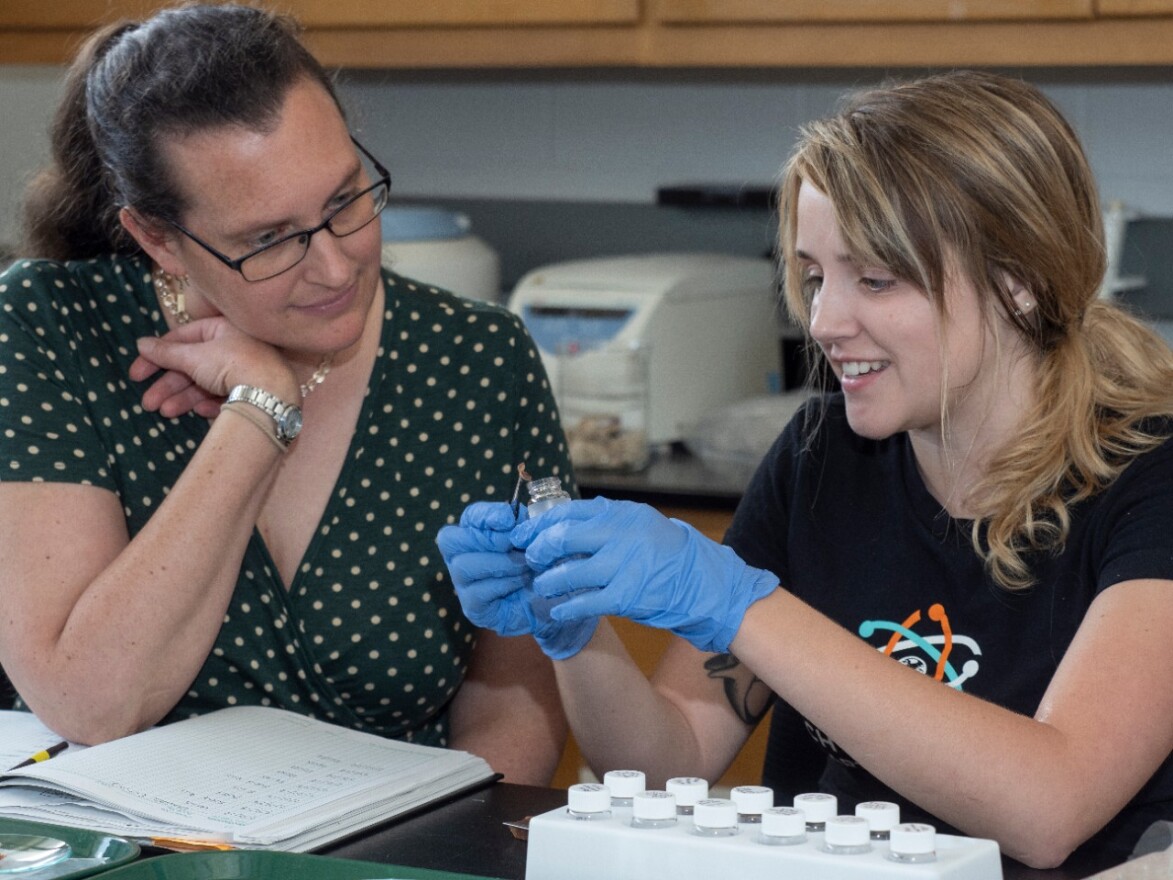 UC associate professor Brooke Crowley, left, works with her former student, UC graduate Maddie Greenwood, in Crowley's lab. 